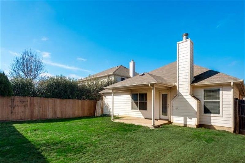    Grassy Back Yard with Covered Porch 