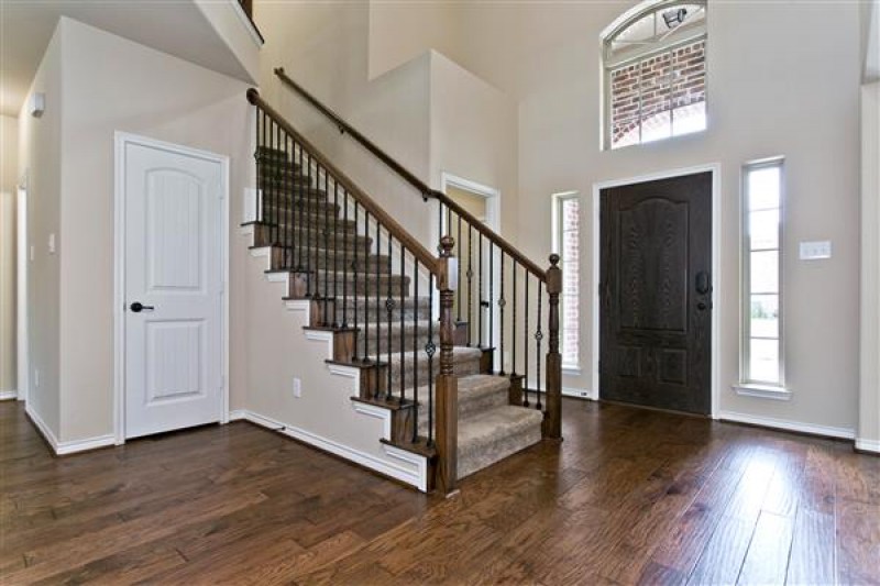    Soaring Foyer with Hardwood Floors 