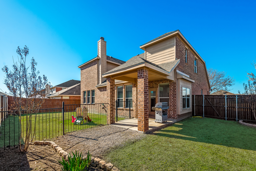    Grassy Backyard with Covered Patio 