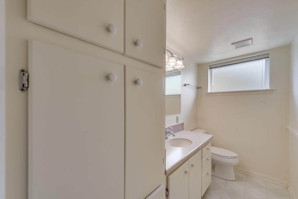    Half Bath features Large Built in Linen Cabinet 