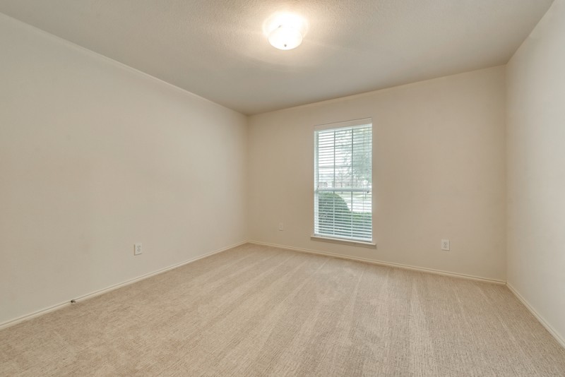    Secondary Bedroom with Recently Installed Carpet 