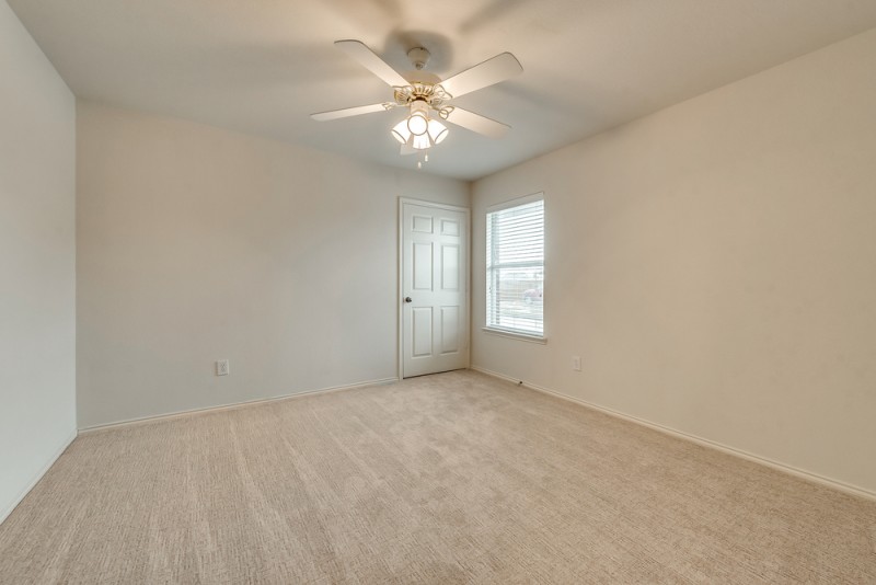    Secondary Bedroom with Recently Installed Carpet 