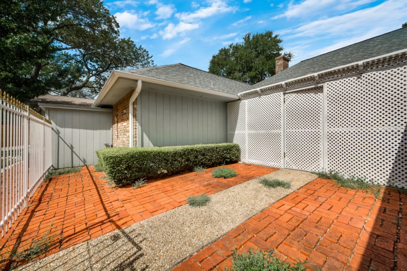    Extended Courtyard with Wrought Iron Fence 