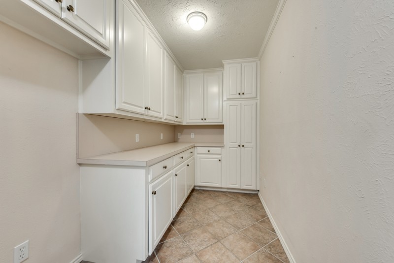    Utility Room with Abundance of Cabinetry 