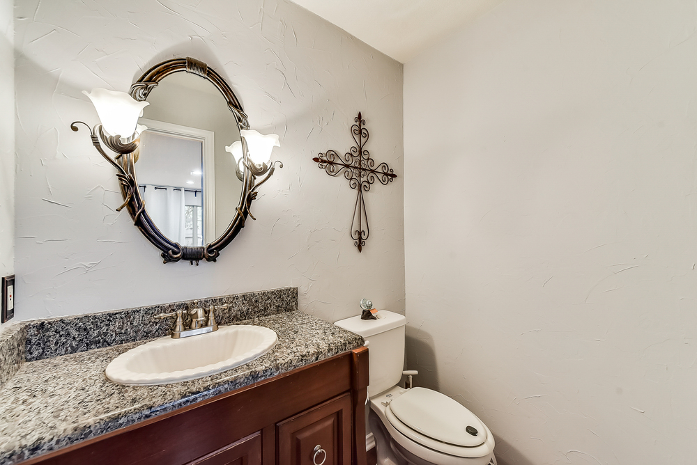    Main Level Half Bath with Furniture Style Vainity with Granite Countertop 