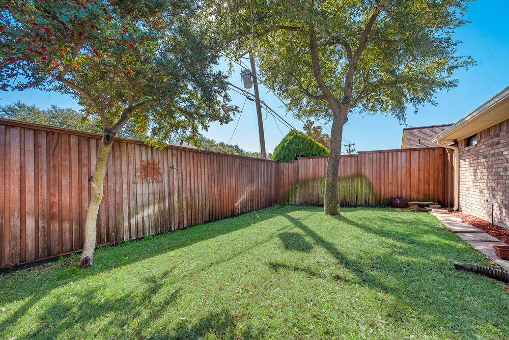    Grassy Backyard with Mature Trees 