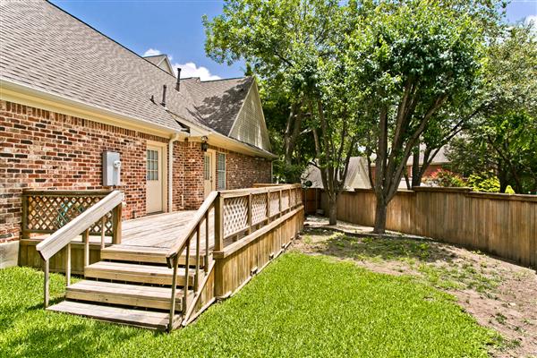    side grass area with deck 