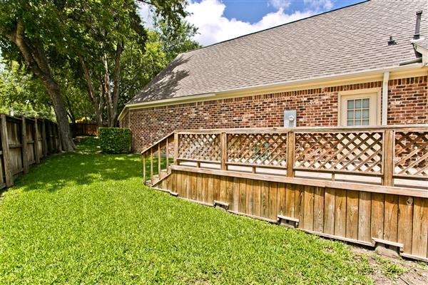    side grass area with deck 