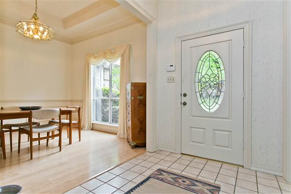    Tiled Foyer with Crown Molding 