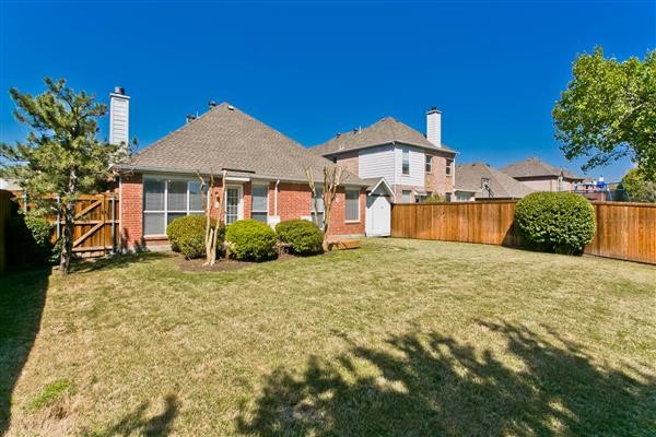    Sprawling Yard with Storage Shed 