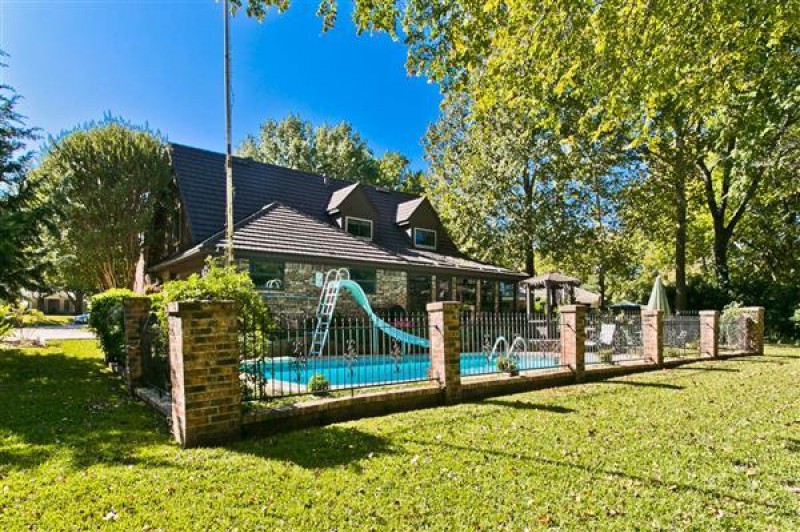    Iron Fence with Brick Posts 