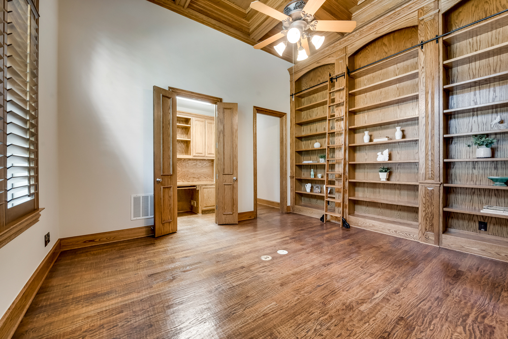    Library with Wall of Built ins and ladder 