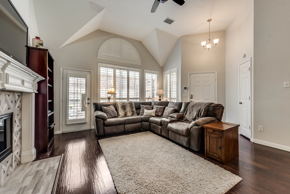    Inviting Family Room with Tile Fireplace and Wall of Windows 