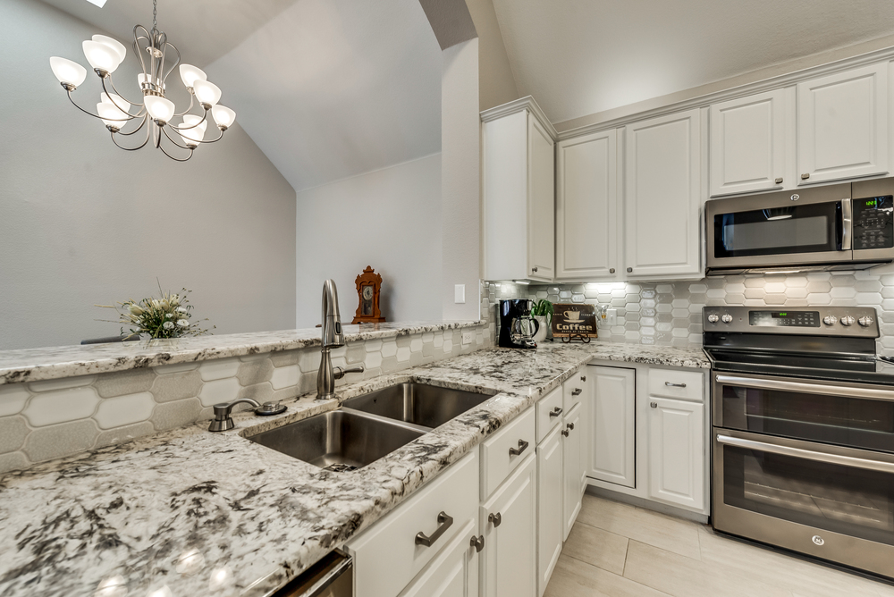    Gourmet Kitchen includes Granite Countertops and Stainless Steel Appliances 