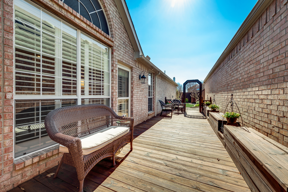    Back Deck with Built In Benches Leads to Grassy and Landscaped Backyard 