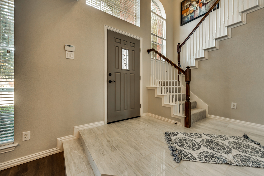    Entry with Soaring Ceilings and Marble Tiled Floor 