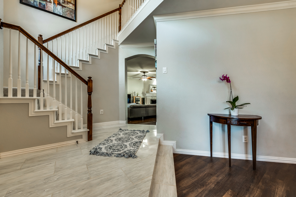    Entry with Soaring Ceilings and Marble Tiled Floor 