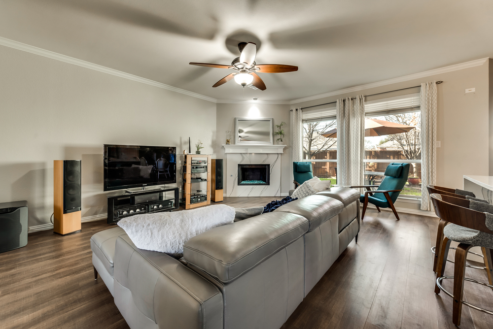    Family Room with Quartz Glass Stone Gas Fireplace and Backyard Views 