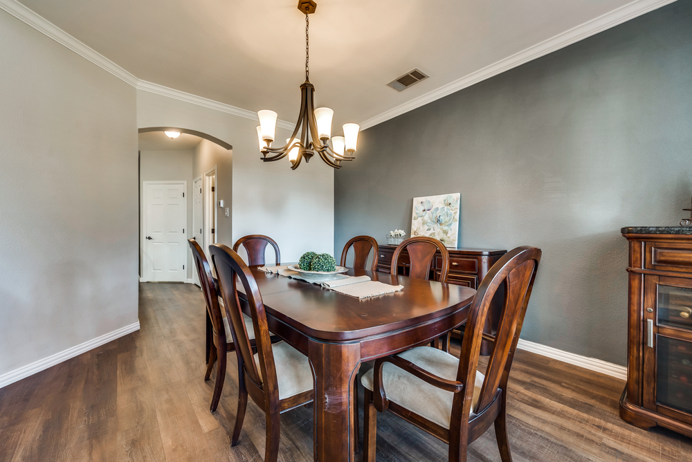    Elegant Formal Dining Room with Sleek Chandelier 