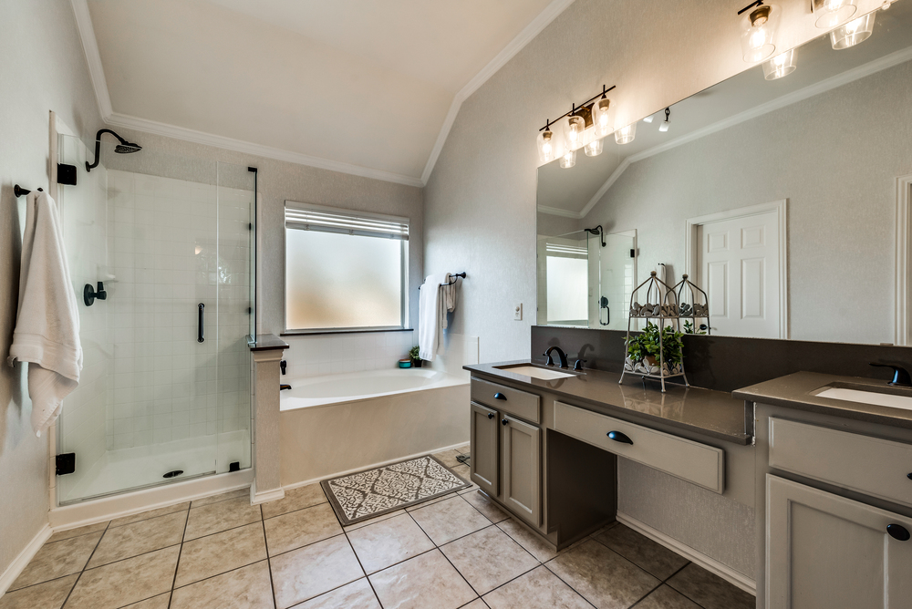    Spa Like Master Bathroom with Seamless Glass Shower and Garden Tub 