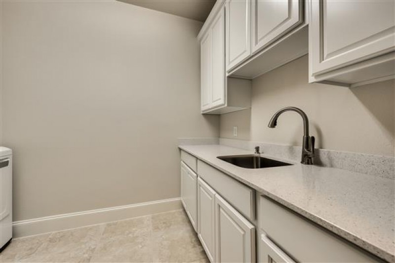    Utility Room with Quartz Counters 