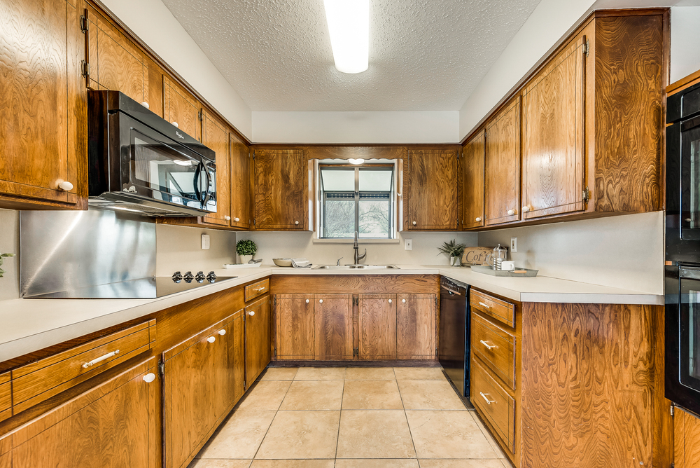    Kitchen has Wood Cabinetry and Double Ovens 