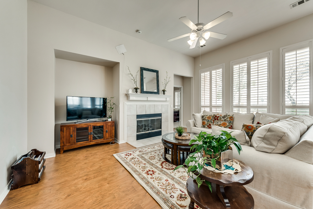    Inviting Family Room with Fireplace and Wall of Windows 