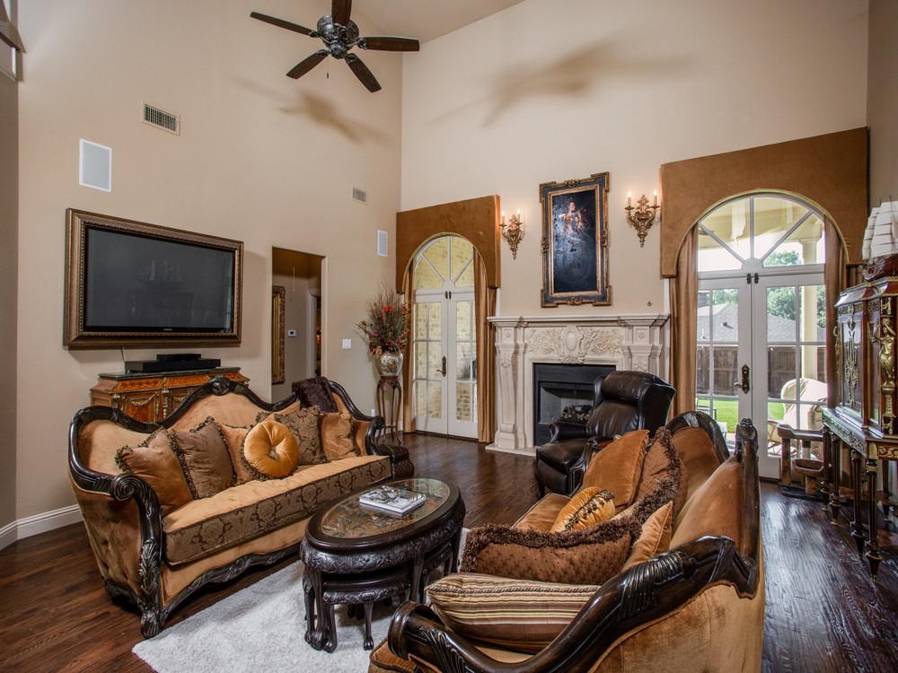    Custom Marble Fireplace Flanked by Doors to Patio 