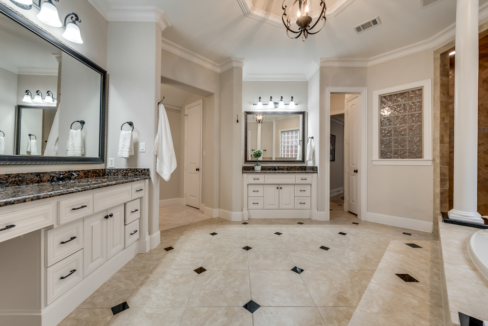    Master Bath has Separate Vanities with Granite Countertops and Ample Storage 