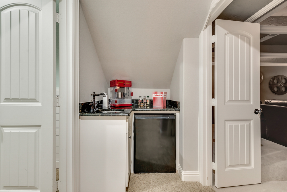    Wet Bar Outside Media Room with Built In Fridge 