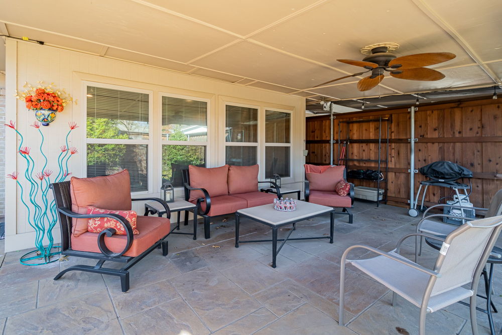    Covered Patio Opens out to Backyard Oasis 