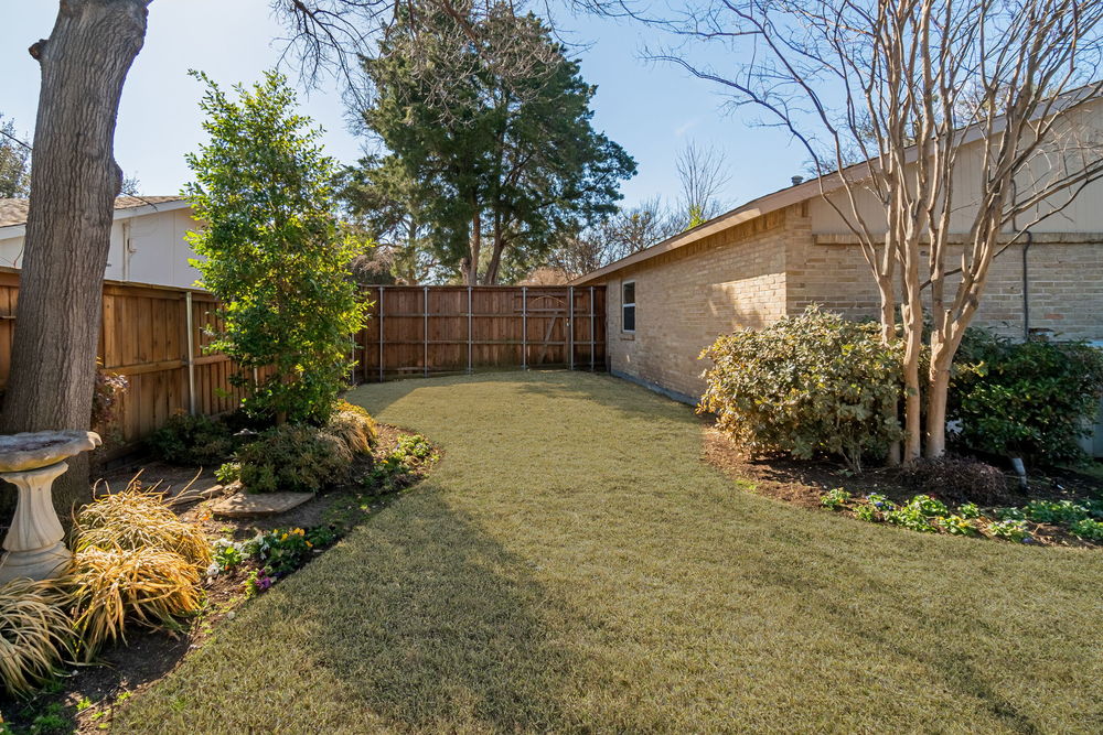    Backyard Oasis with Lush Landscaping and Mature Trees 