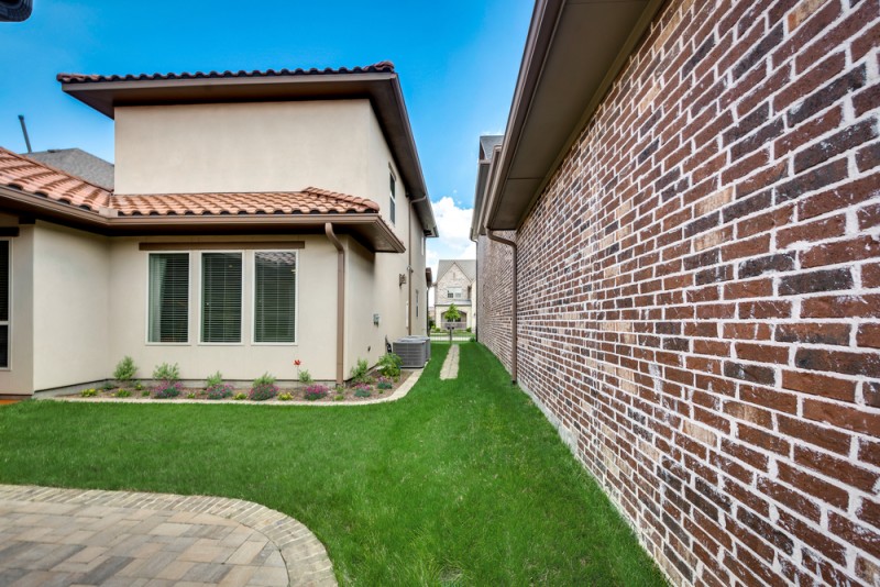    Grassy Backyard Area with Landscaping 