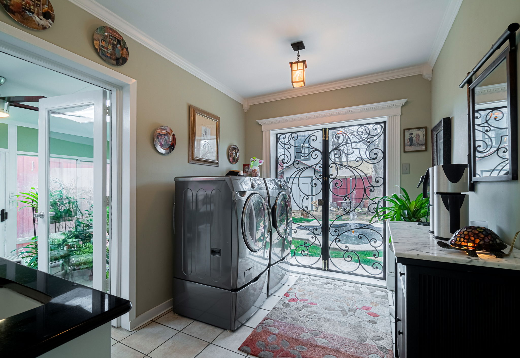    Utility Room has Sink and Stunning Wrought Iron Door 