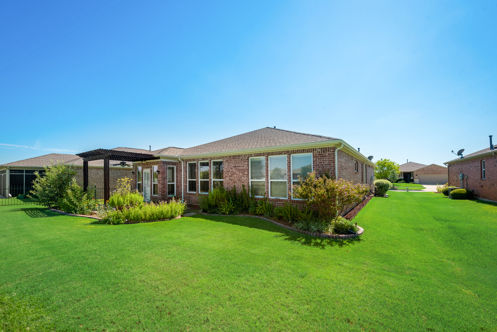    Grassy Backyard with Lush Landscaping 