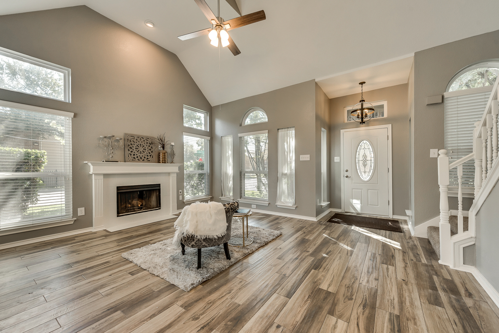    Entry opens into Family Room with Wood Burning Fireplace 