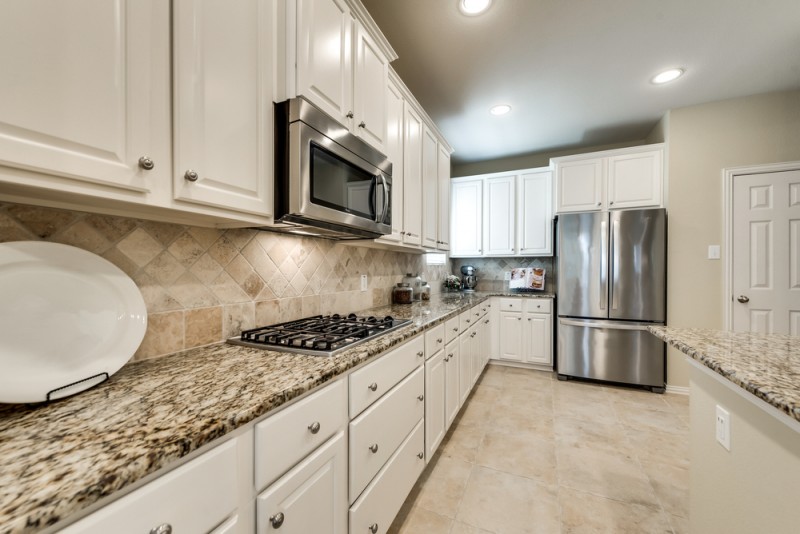    Gourmet Kitchen with Abundance of White Cabinetry 