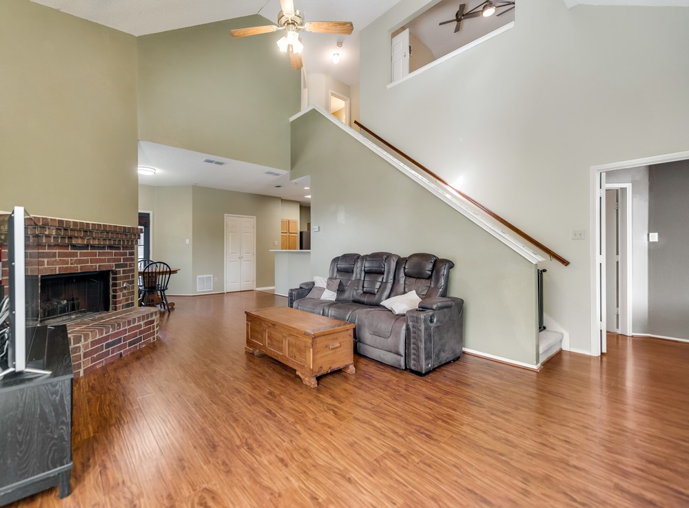    Inviting Family Room with Brick Fireplace 