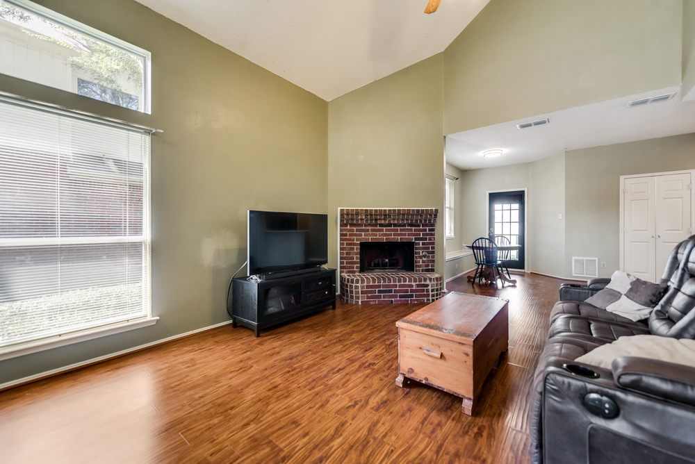    Inviting Family Room with Brick Fireplace 