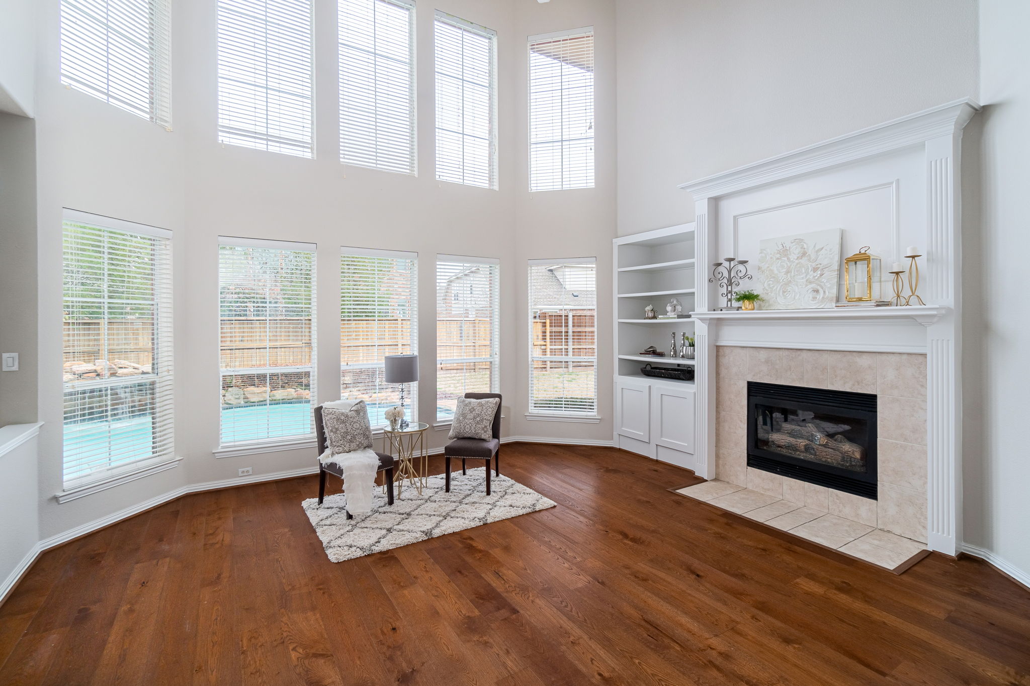    Inviting Family Room with Wall of Windows and Backyard Views 