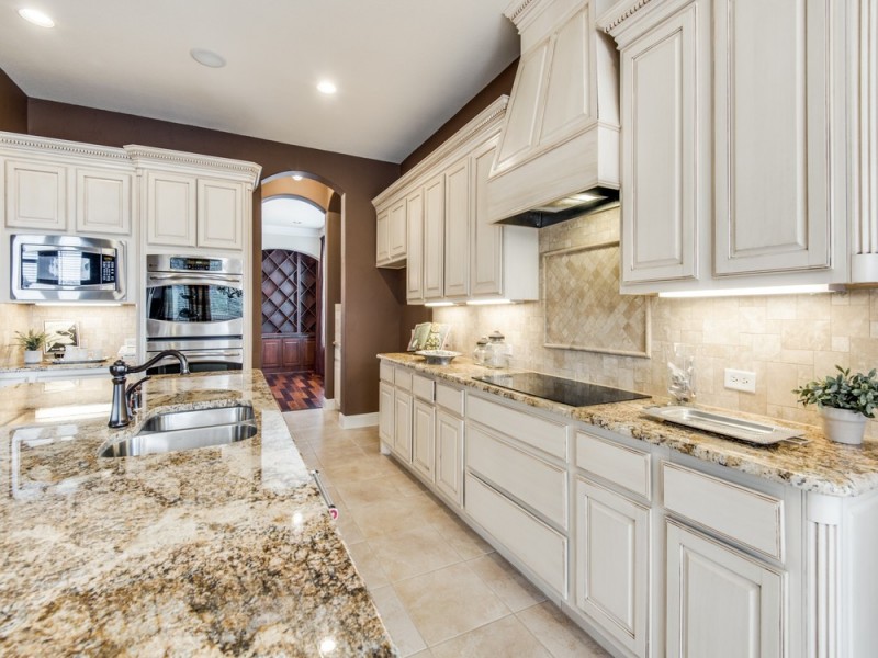    Granite Counters and Antiqued Cabinetry 