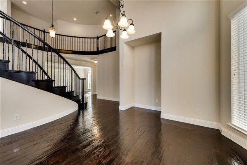    Spiral Wood Staircase with Iron Spindles 