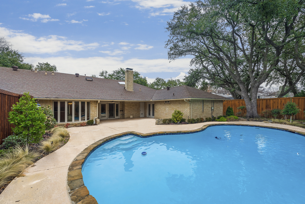    Backyard Oasis with Mature Trees  Sparkling Swimming Pool and Covered and Extended Patio 