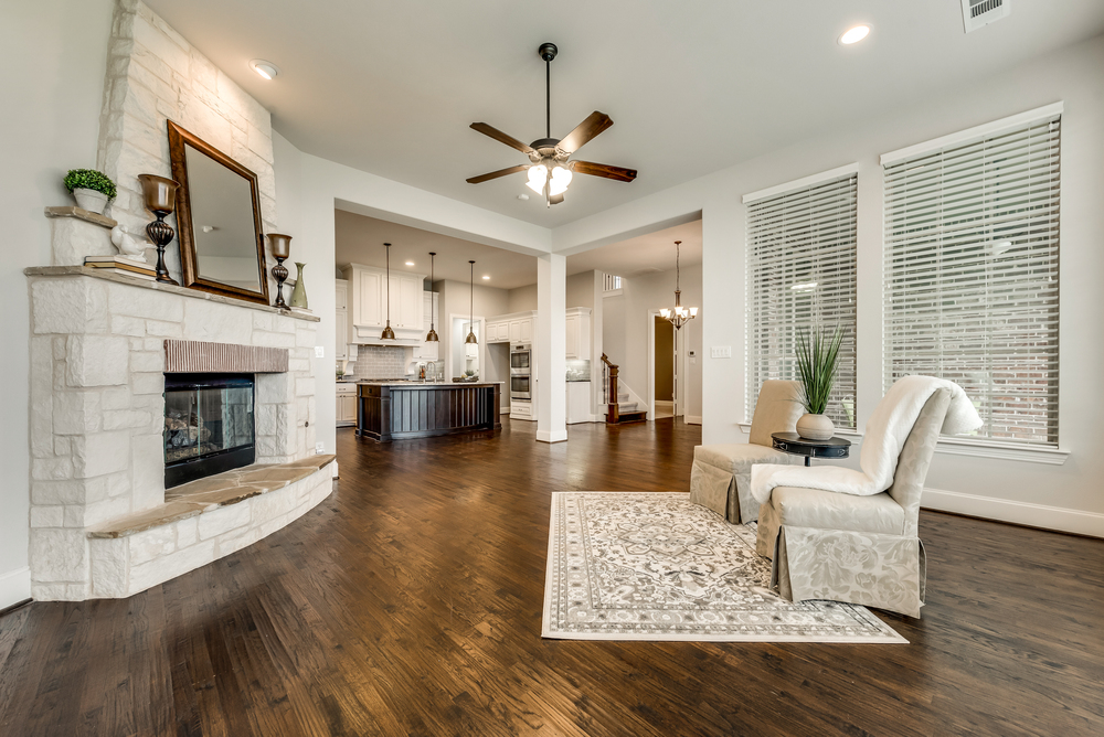    Inviting Family Room with Austin Stone Fireplace and Walls of Windows 