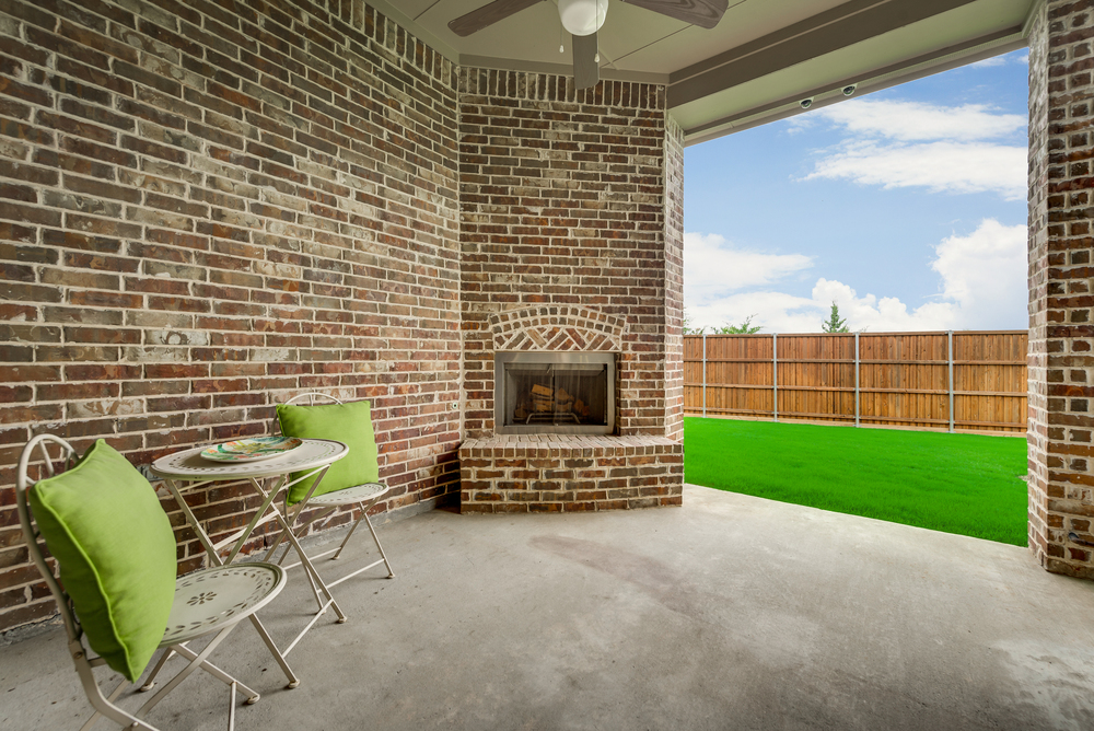    Covered Patio with Outdoor Fireplace and Plumbed for Gas Grill 