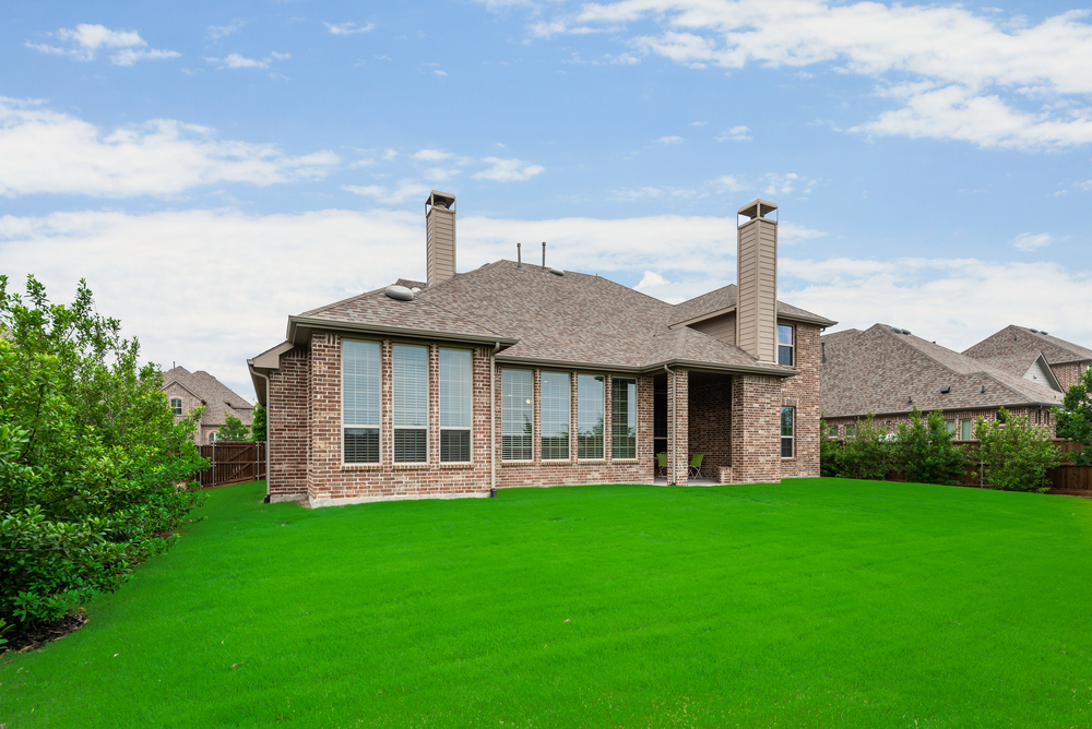    Grassy Backyard with Board on Board Fencing 